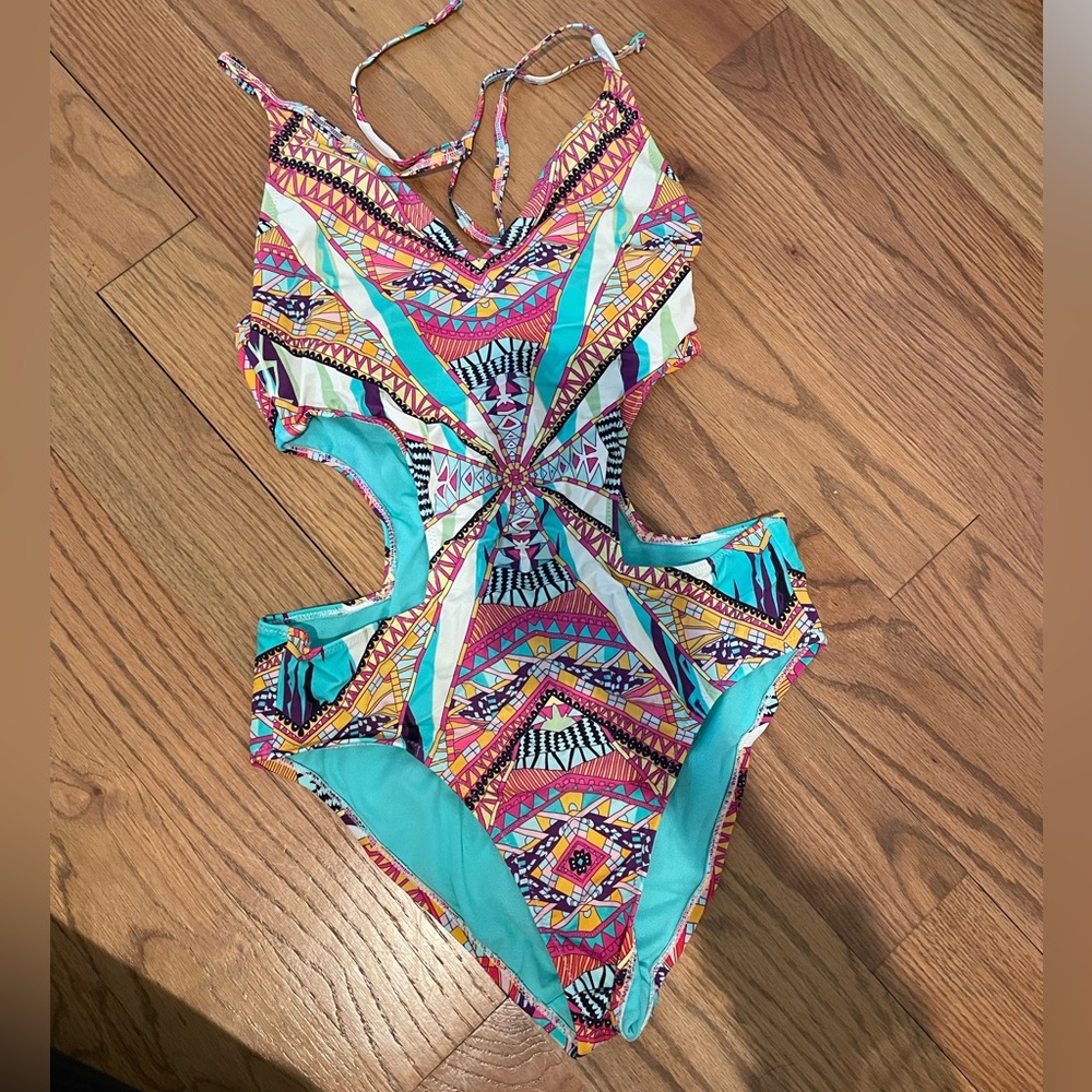 Jessica Simpson swim suit cut out sides, very comfortable and flattering.